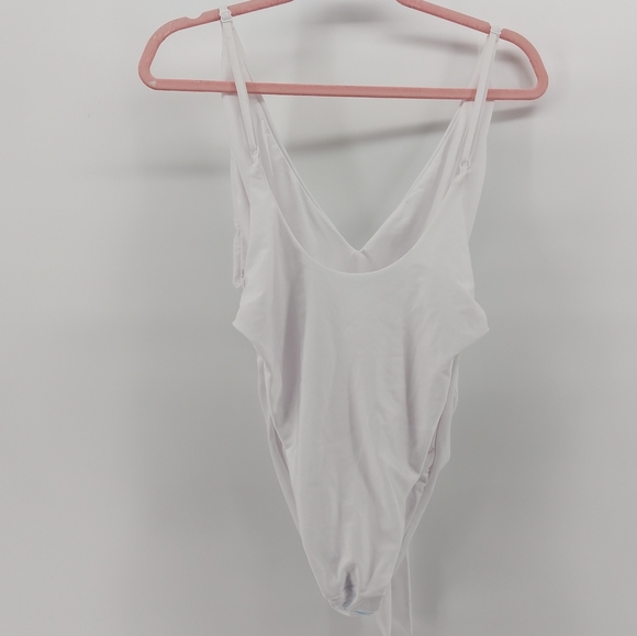 ASOS DESIGN skinny strap deep plunge tie front swimsuit in shiny white - Picture 6 of 9